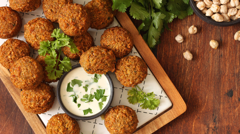 Falafel on a white patterned slicing board