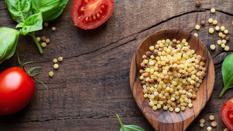 fregola in wooden spoon 