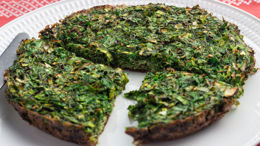 Kookoo sabzi on a white plate