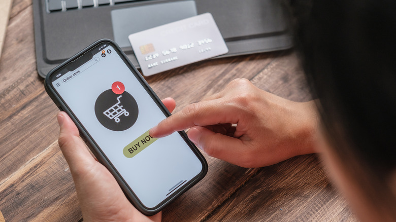 person shops online on phone