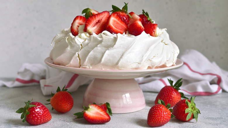 Pavlovas with strawberries on cake stand
