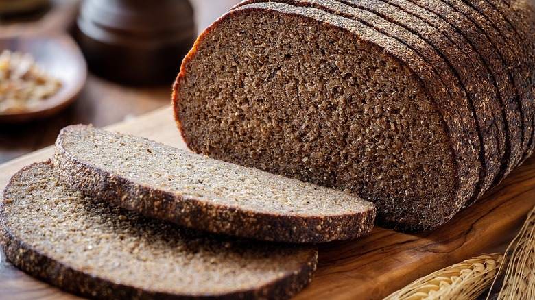 Sliced loaf of dark rye bread