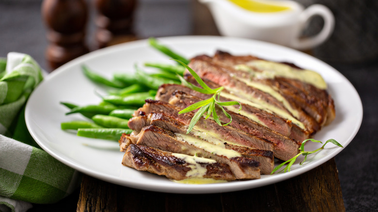Tarragon on a plate of meat