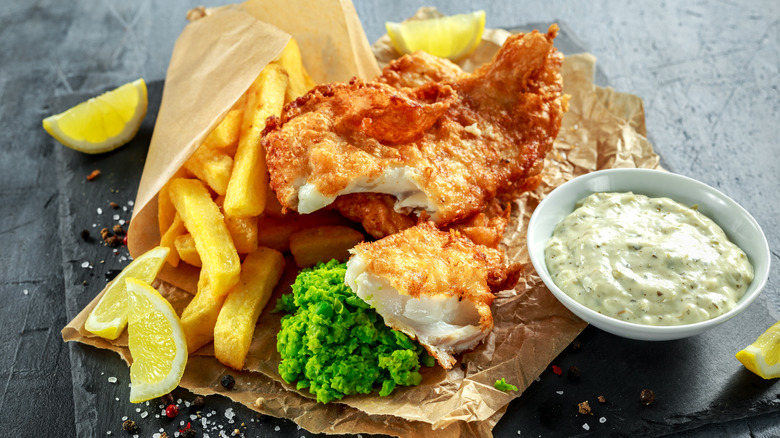 Fish and chips with lemon wedges and tartar sauce