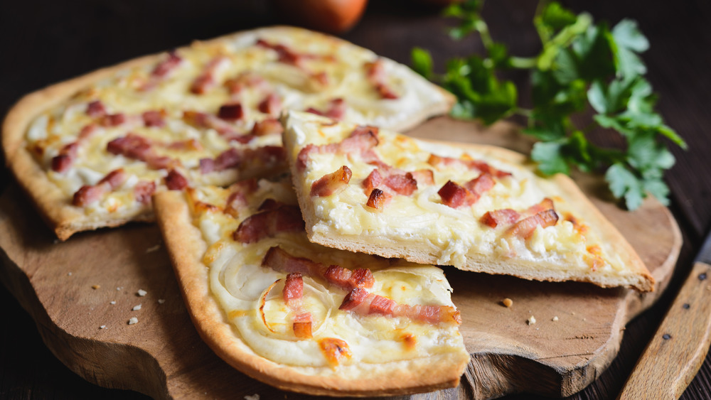 Tarte flambée on a cutting board