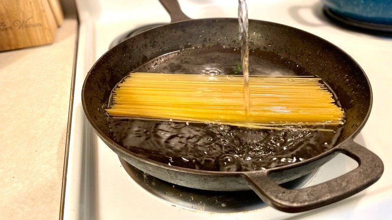 noodles in skillet with water