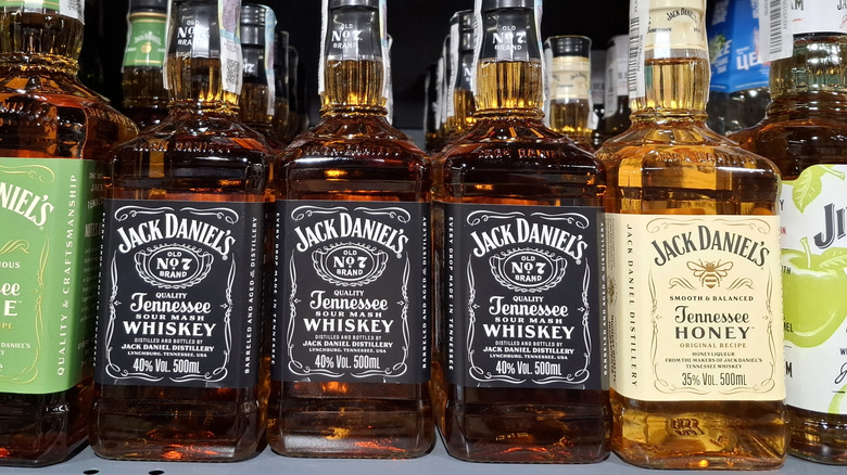 Various bottles of Jack Daniel's on store shelf.