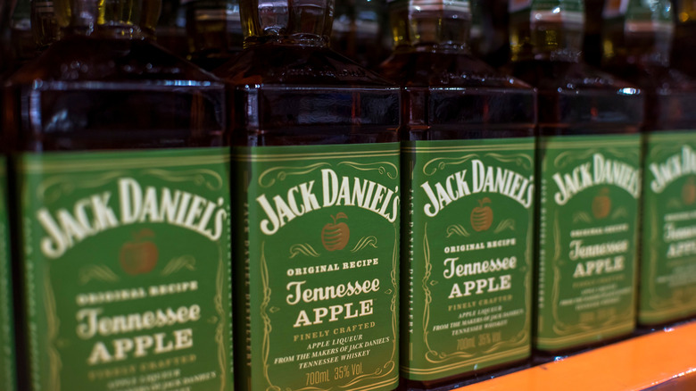 Jack Daniel's Tennessee apple bottles on store shelf.