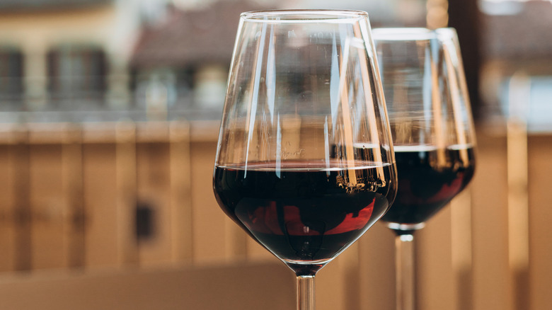 Two glasses of red wine.