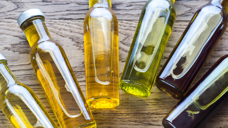 Bottles of oil on wood table