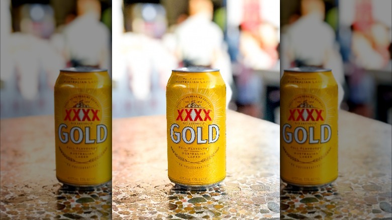 XXXX Beer can on table