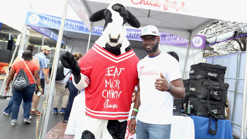 Chick-fil-A Cow posing with staff