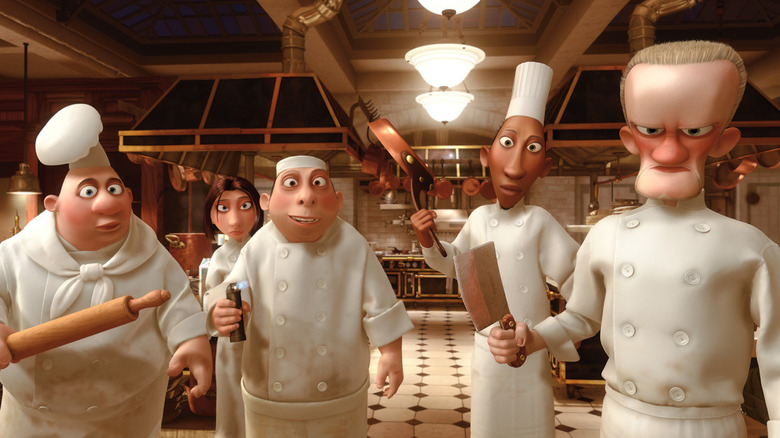 a shot from the disney movie ratatouille of chefs in a kitchen