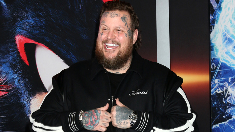 Jelly Roll smiling while giving two thumbs up