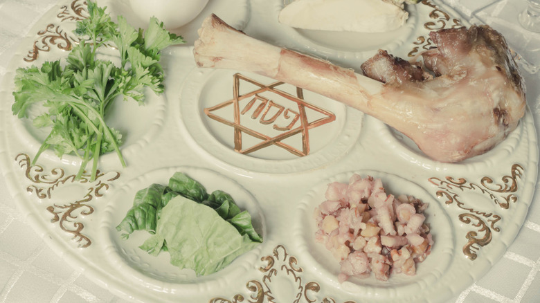 Leg of lamb with herbs on a Passover plate