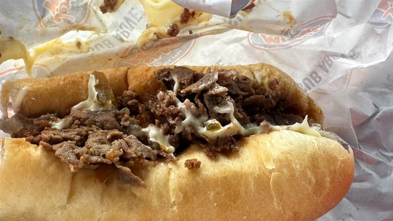 A close-up shot of a Jersey Mike's Philly cheesesteak sandwich.