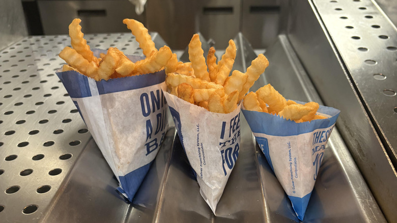 Three sizes of Culver's french fries, still in the kitchen, but ready to go.