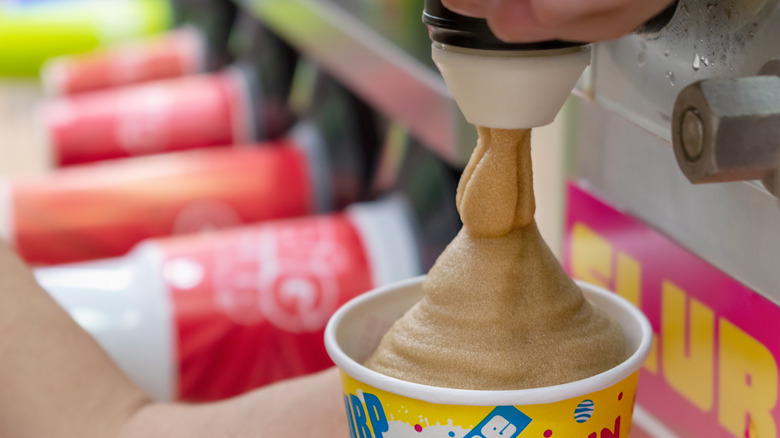 Dispensing Slurpee into a cup