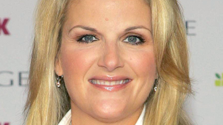 A close-up of Trisha Yearwood wearing eyeshadow and dangling diamond earrings