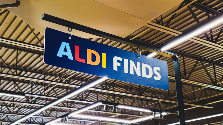 Store signage hung from the ceiling with the words Aldi Finds