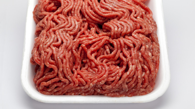 Ground beef sits in a white tray.