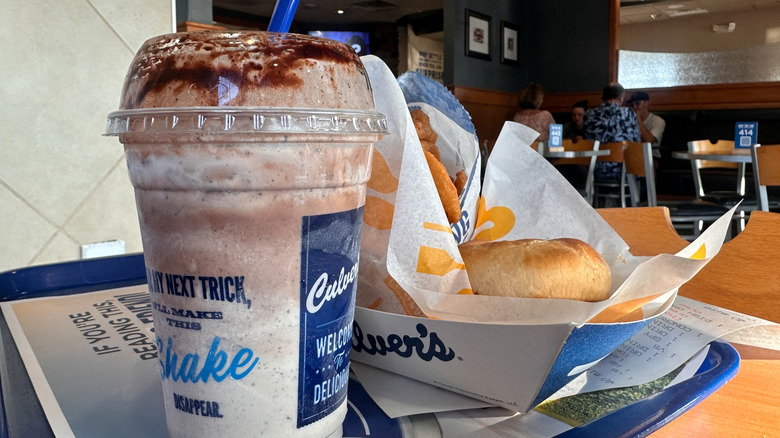 Culver's chocolate malt sits on a tray alongside a ButterBurger.