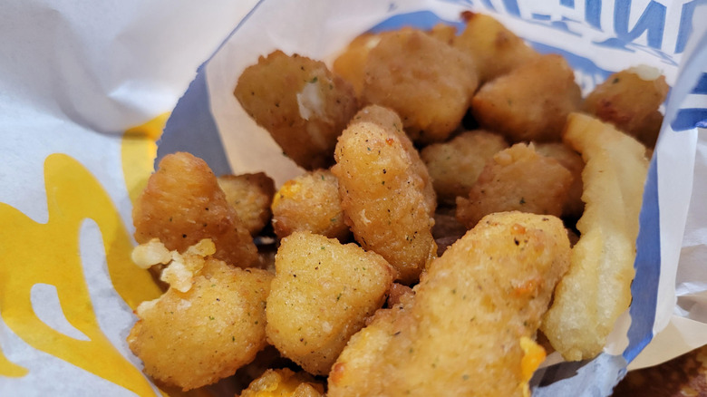 Closeup of Culver's cheese curds inside the paper bag
