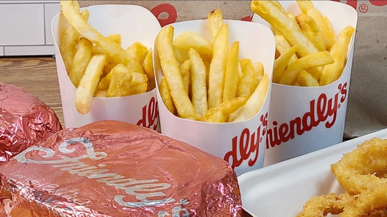 Friendly's burger, fries, and onion rings