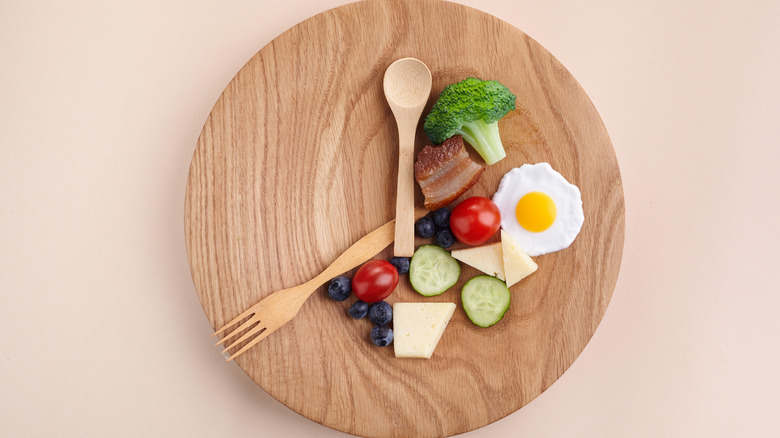 plate with clock arms and food