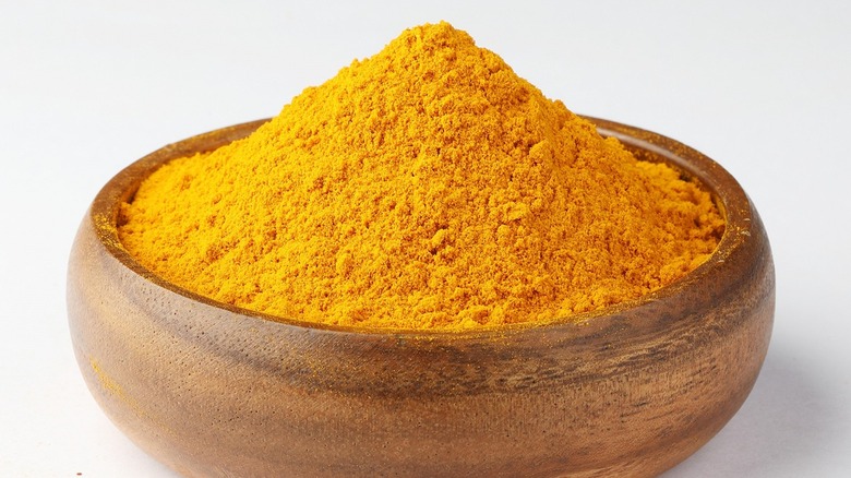 Curry powder in brown bowl