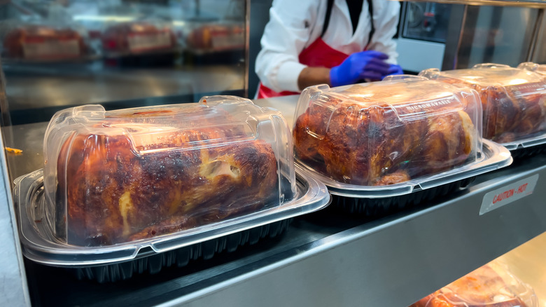 Packaged rotisserie chickens on store shelf