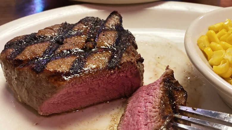 Medium rare steak cut on a plate 
