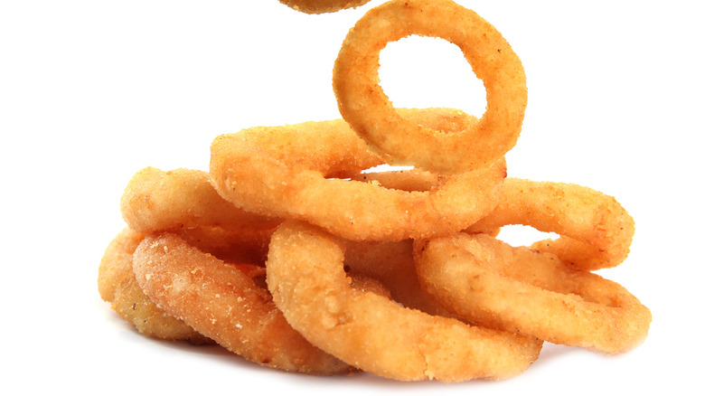 Onion rings on white background