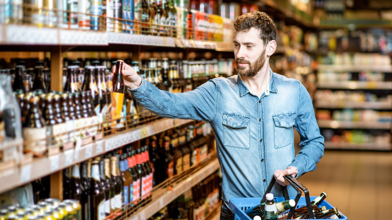 man shops for beer