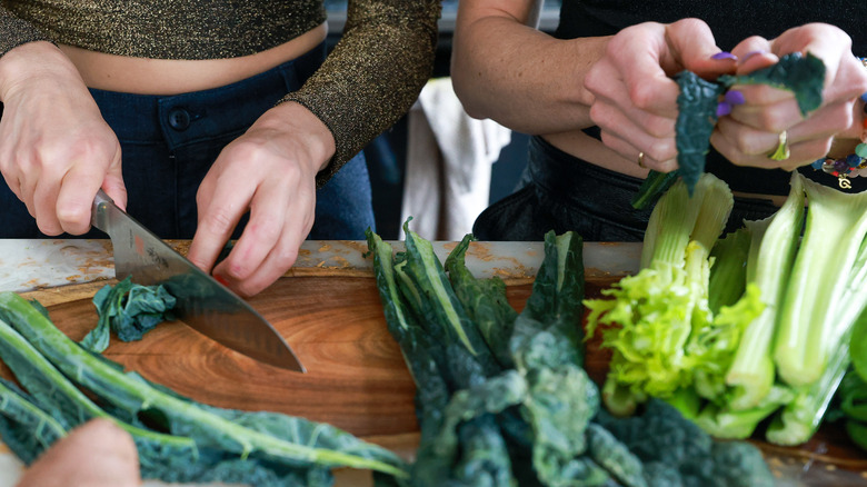 Two women preparing vegetables 