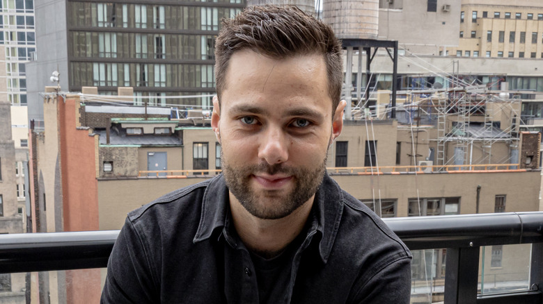 Max Greb smiling on balcony 