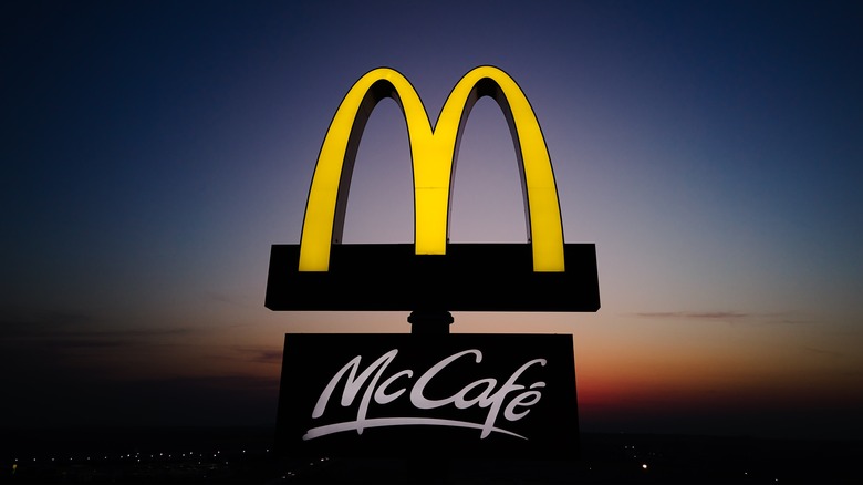 A sign of Mcdonald's McCafe during sunset