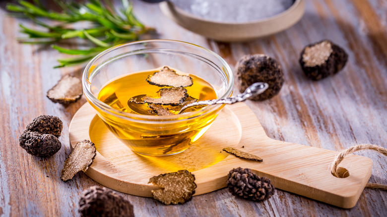 Truffle oil in a small glass bowl with a spoon