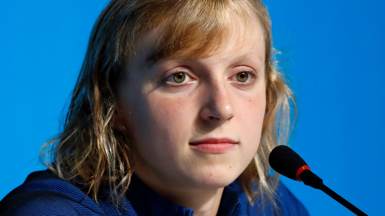 Katie Ledecky sitting near microphone