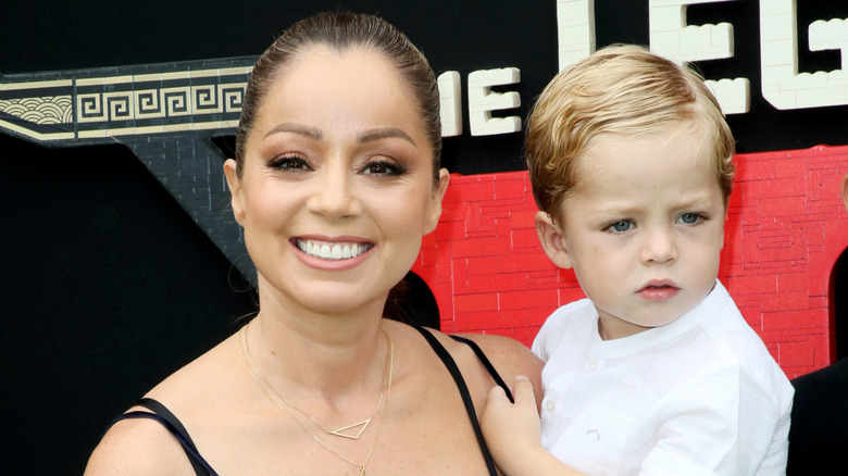 Marcela Valladolid smiling with her son at event