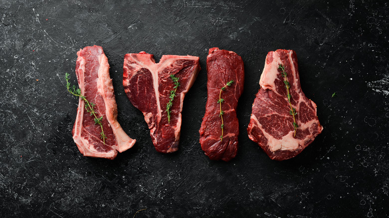 raw steak on marble counter