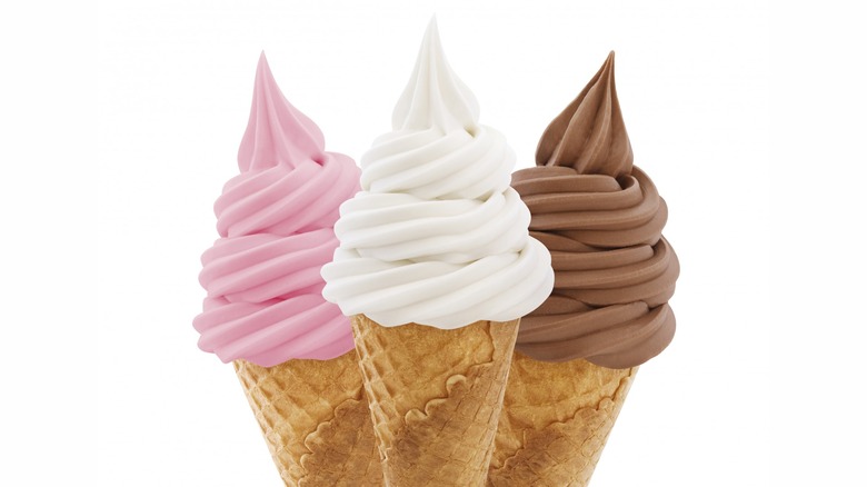 Trio of soft serve cones on white