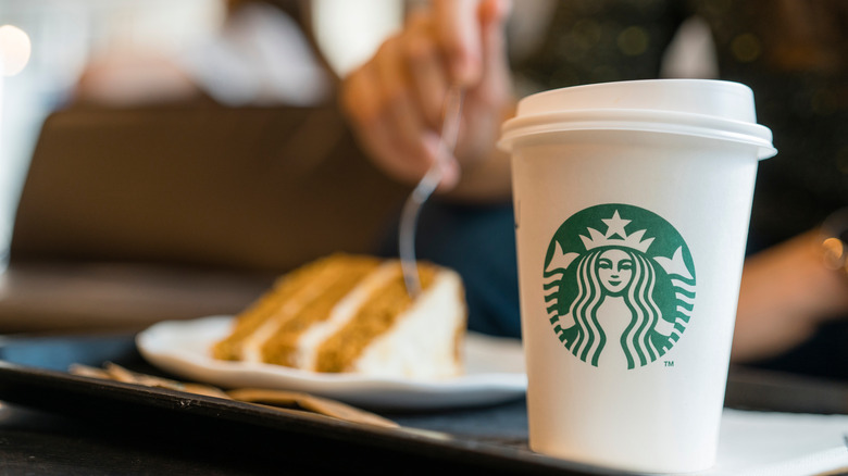 Starbucks cup and pastry of unconfirmed origin
