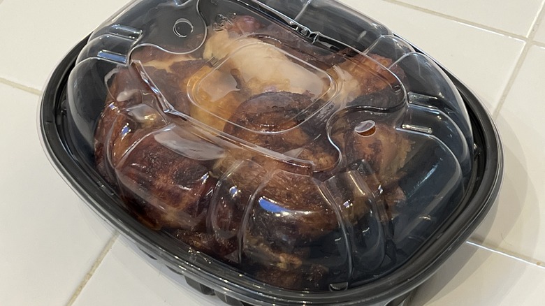 Rotisserie chicken in plastic container