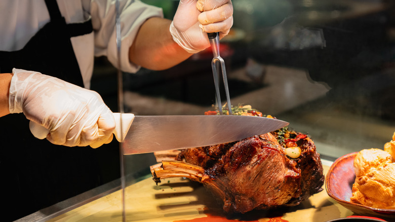 Chef slicing roast meat
