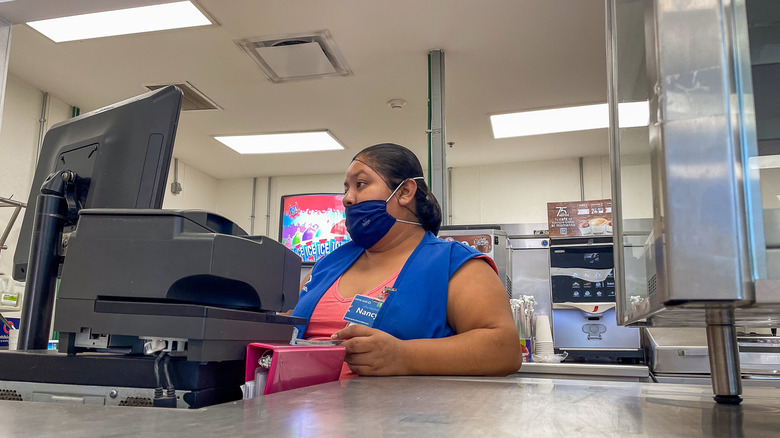 A cashier at the Sam's Club Café