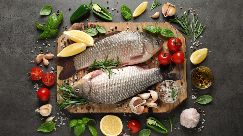 two fish on cutting board