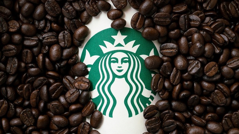 Starbucks logo surrounded by coffee beans