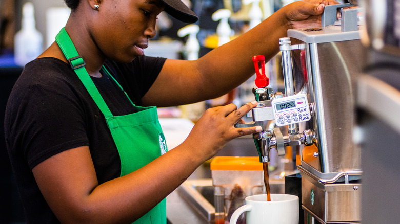 Starbucks barista pouring