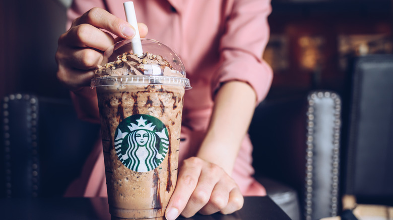 A barista and Starbucks Frappucino